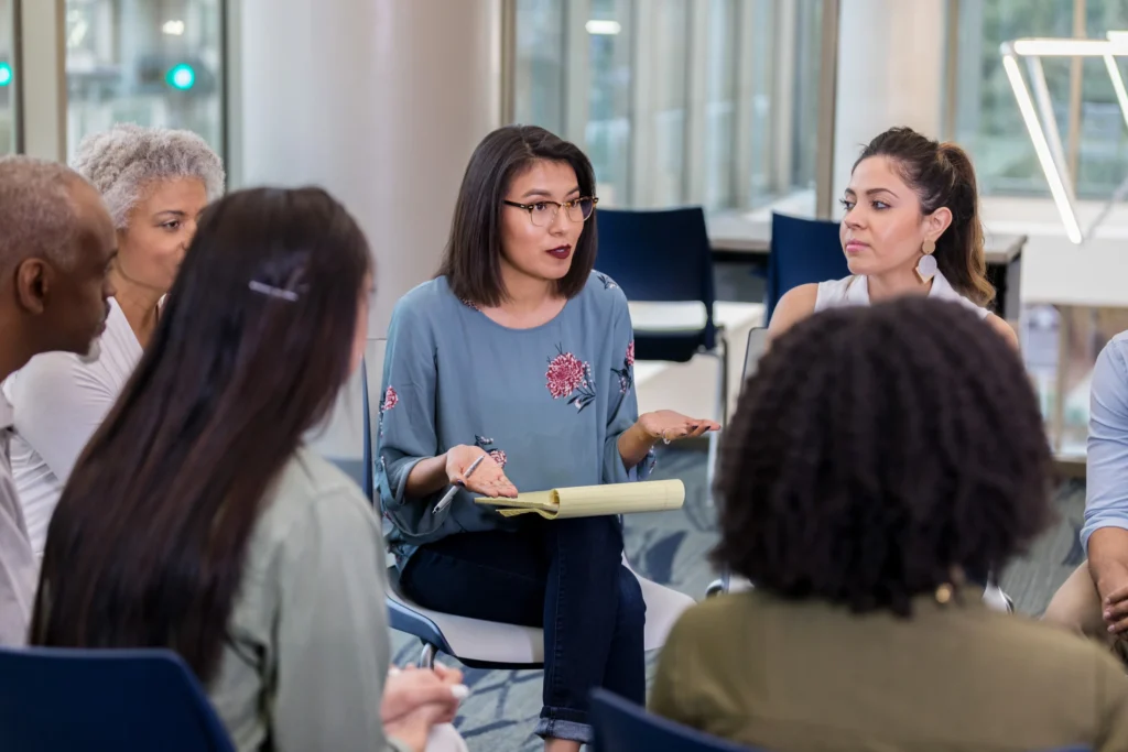 Native Woman in a Group Discussion