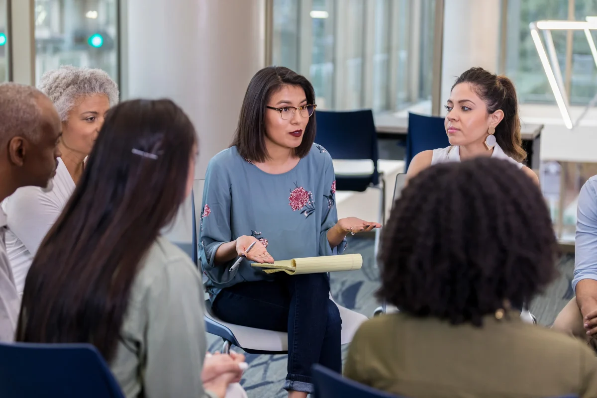 Native Woman in a Group Discussion
